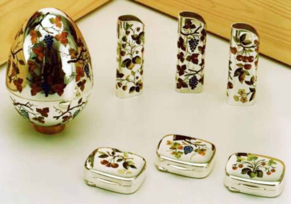 Gucci silver products by Salimbeni. An Egg style Faberge, Pill boxes and lighter covers.
With enamel and miniatures handmade.